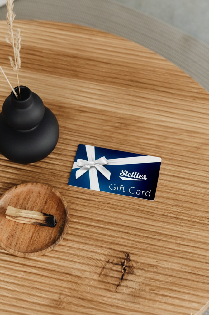 Stellies gift card on a wooden surface