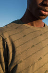 The All-Over Slogan Tee In Sage Green - Stellies Authentic Clothing